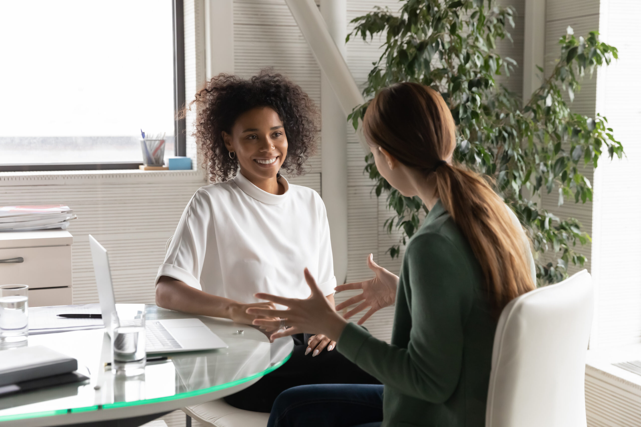 Happy Diverse Millennial Women chatting